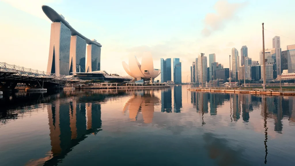 Singapore skyline at Marina Bay with Marina Bay Sands and ArtScience Museum reflected in calm water