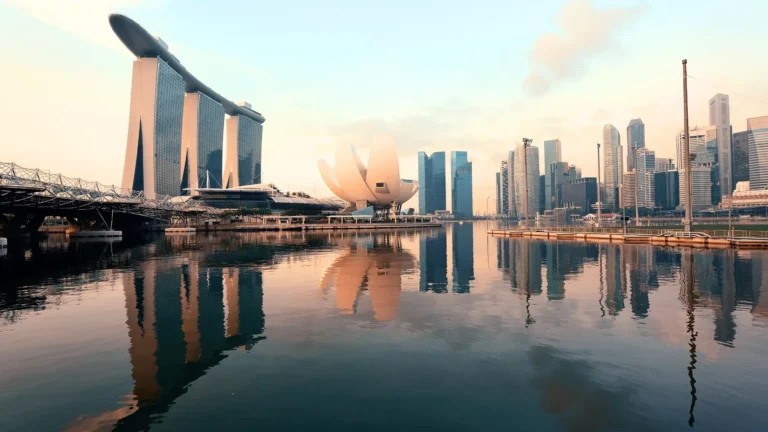 Singapore skyline at Marina Bay with Marina Bay Sands and ArtScience Museum reflected in calm water