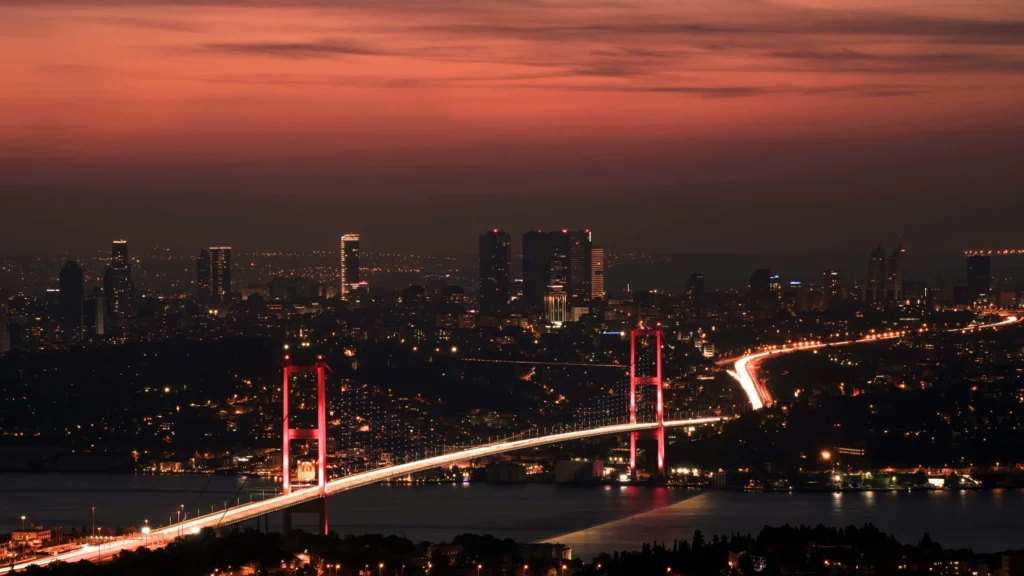 Bosphorus Bridge illuminated at night with Istanbul skyline