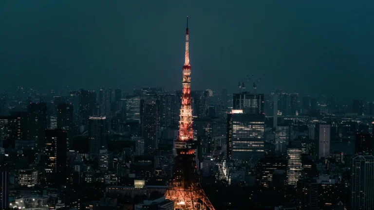 Tokyo skyline at night featuring Tokyo Tower illuminated above the city lights in Japan